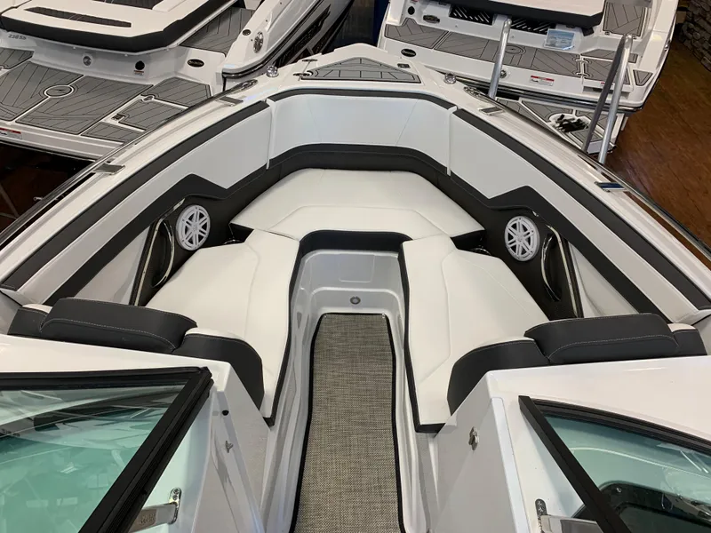 Slide: The Image of 2024 Monterey 258 Super Sport boat interior with white and black seating. - 10