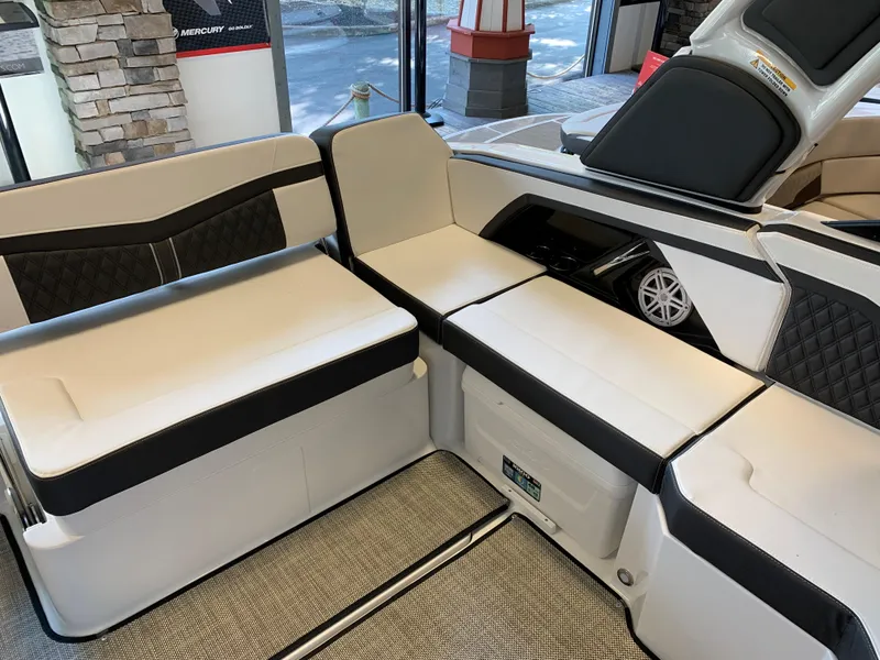 Slide: The Image of 2024 Monterey 258 Super Sport boat interior with white and black seating. - 3