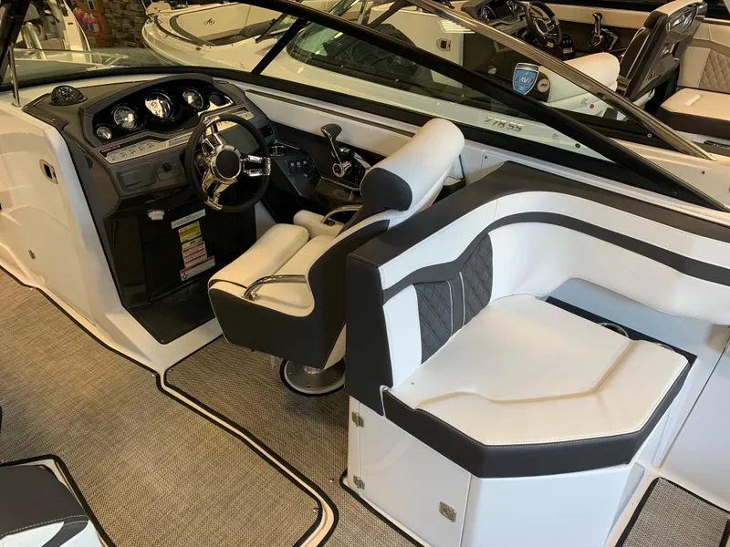 Slide: The Image of 2024 Monterey 258 Super Sport boat interior with modern dashboard and seating. - 4