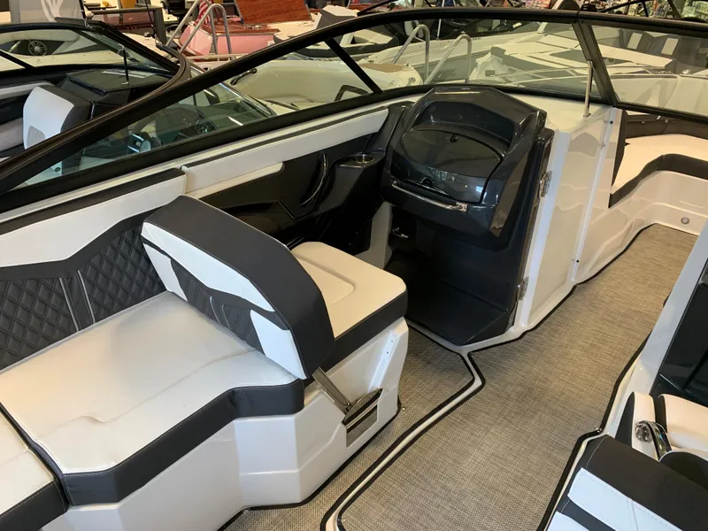 Slide: The Image of 2024 Monterey 258 Super Sport boat interior with modern seating and dashboard. - 7