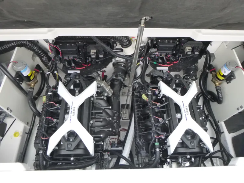 Slide: The Image of 2024 Yamaha Boats 252XE engine compartment with dual engines and wiring. - 14