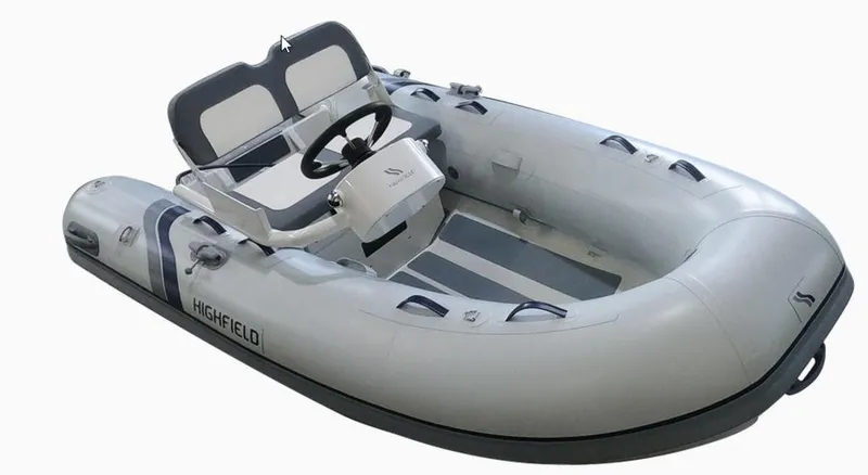 Slide: The Image of 2023 Highfield Ultralite 290FD inflatable boat with steering console and seating. - 2