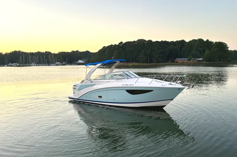 Slide: The Image of 2022 Regal 26XO boat on calm lake at sunset. - 22