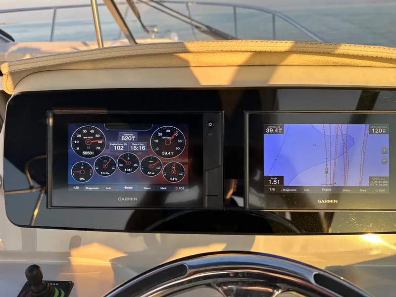 Slide: The Image of Garmin navigation and control screens on a 2022 Regal 26XO boat dashboard. - 29