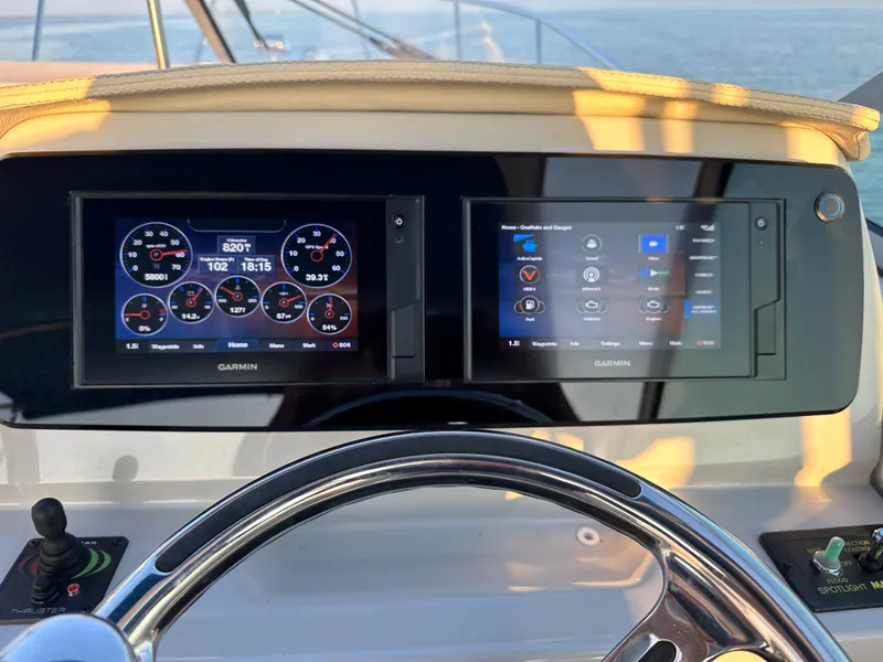 Slide: The Image of 2022 Regal 26XO boat dashboard with Garmin navigation displays. - 30