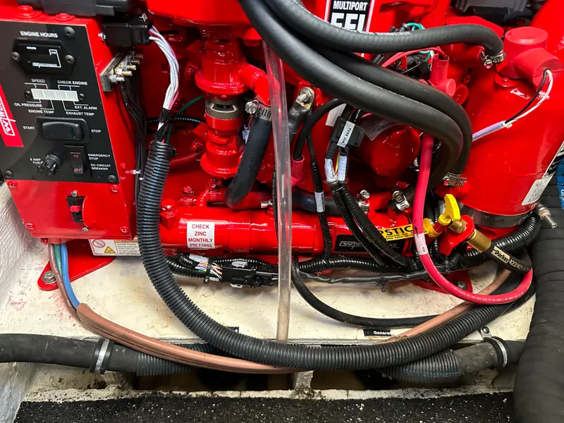 Slide: The Image of 2022 Regal 26XO engine compartment with wiring and fuel system components. - 33