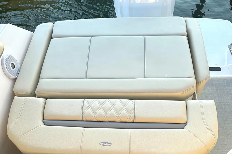 Slide: The Image of 2022 Regal 26XO boat with beige cushioned seating. - 40