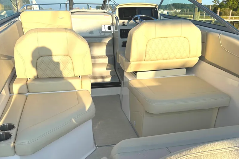 Slide: The Image of Interior of a 2022 Regal 26XO boat with beige leather seating. - 5
