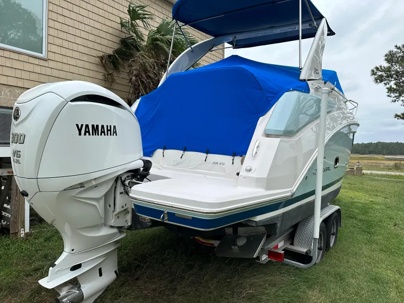 Slide: The Image of 2022 Regal 26XO boat with Yamaha V6 outboard engine on trailer. - 7