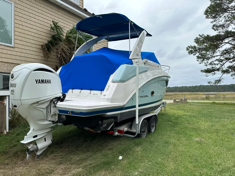 Slide: The Image of 2022 Regal 26XO boat with Yamaha outboard motor on trailer. - 8