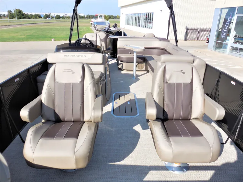 Slide: The Image of 2024 Bennington 23 SXF-APG pontoon boat with luxurious seating and modern design. - 4