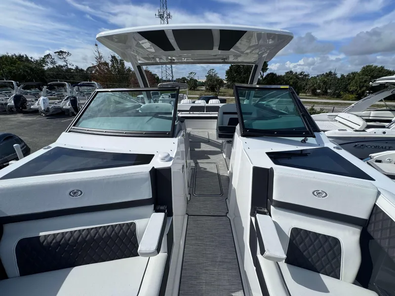 Slide: The Image of 2024 Cobalt R33 boat with dual windshields and luxurious seating. - 11