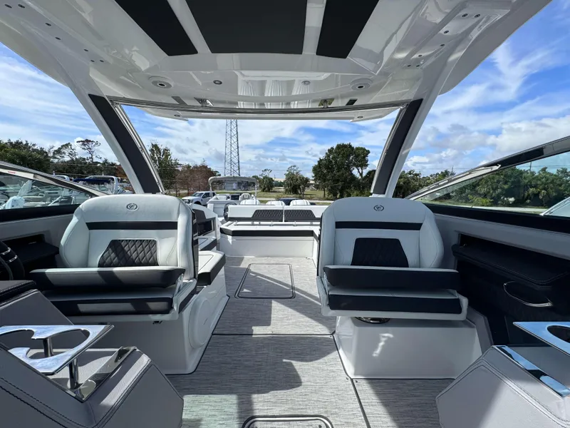 Slide: The Image of 2024 Cobalt R33 boat interior with luxurious seating and modern design. - 14