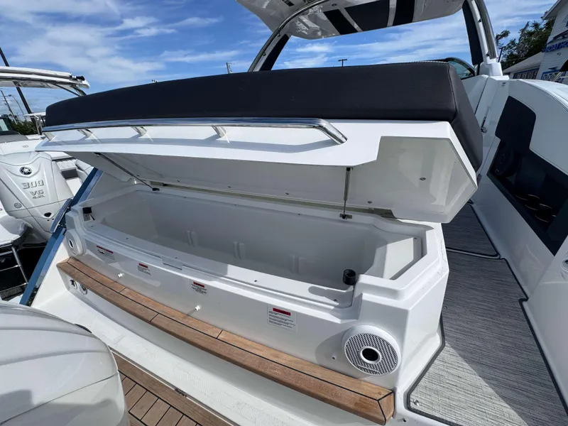 Slide: The Image of 2024 Cobalt R33 boat with open storage compartment and Yamaha 300 V6 engine. - 20