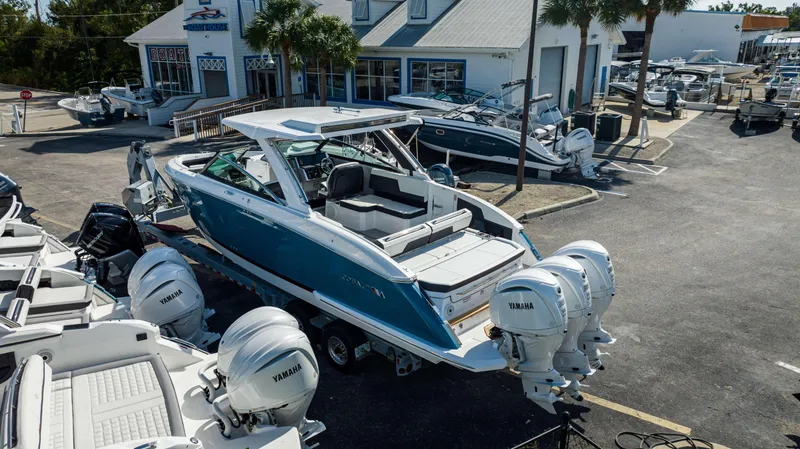 Slide: The Image of 2024 Cobalt R33 boat with Yamaha engines at a dealership. - 26