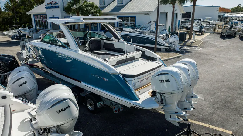 Slide: The Image of 2024 Cobalt R33 boat with Yamaha engines at a dealership. - 27