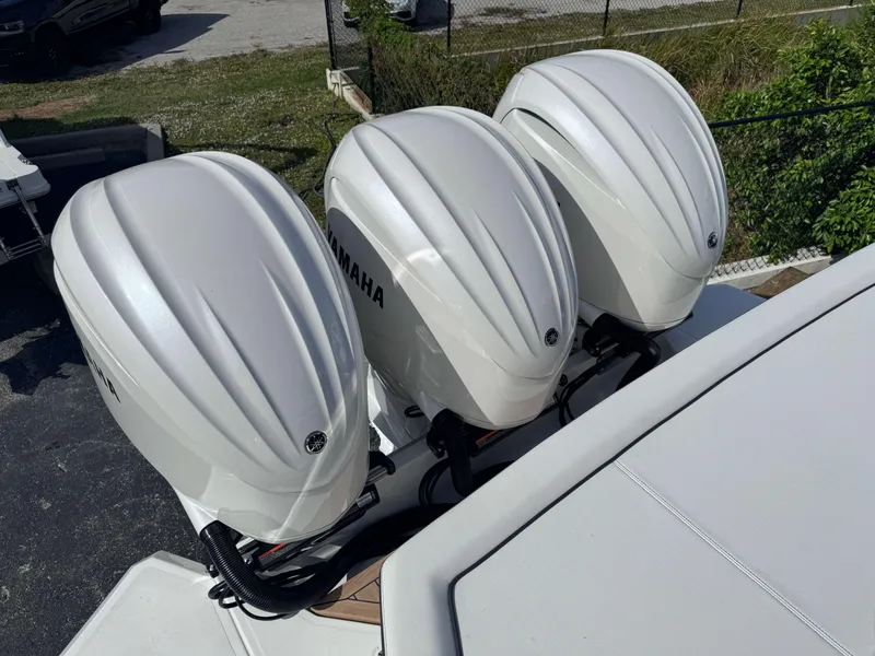 Slide: The Image of Triple Yamaha outboard engines on a 2024 Cobalt R33 boat. - 6