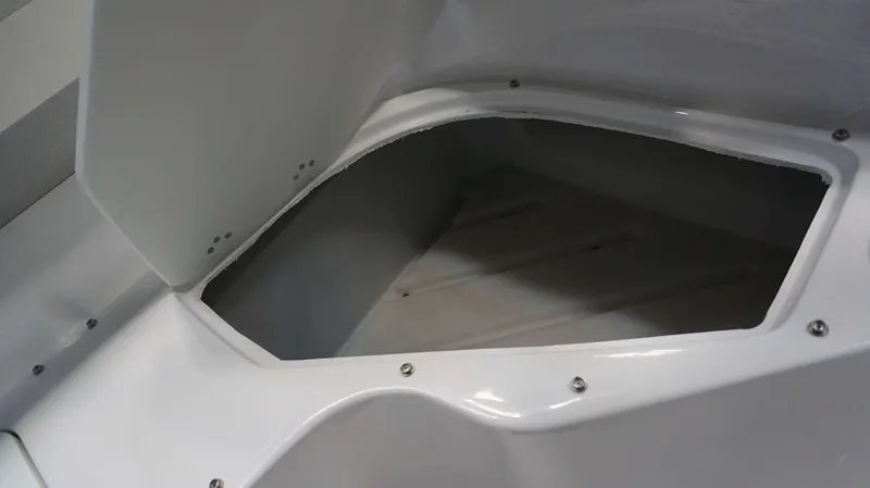 Slide: The Image of 2024 Hurricane 231 SS boat storage compartment with open lid. - 12