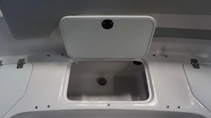 Slide: The Image of Open storage compartment on 2024 Hurricane 231 SS boat. - 14