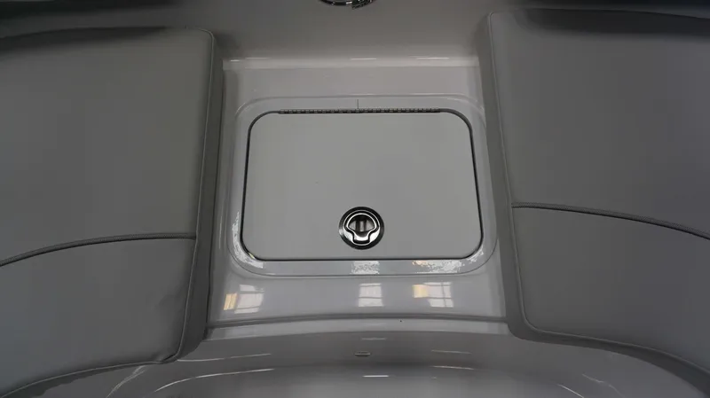 Slide: The Image of 2024 Hurricane 231 SS boat storage compartment with cushioned seating. - 18