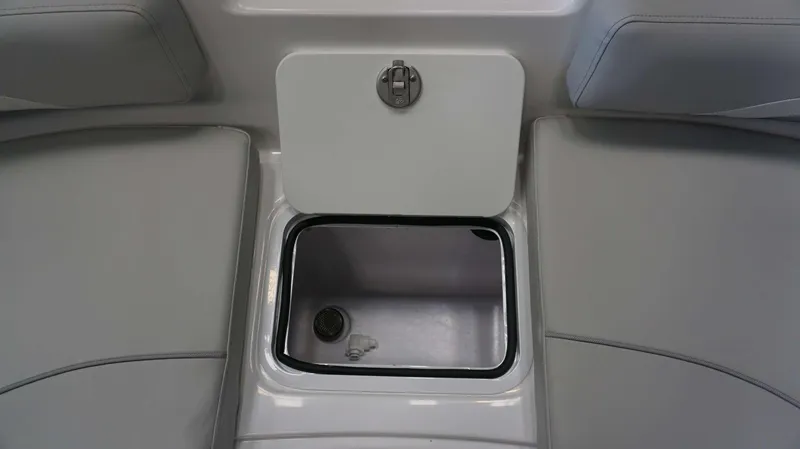 Slide: The Image of 2024 Hurricane 231 SS boat storage compartment with latch. - 19