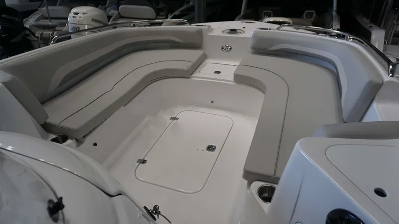 Slide: The Image of 2024 Hurricane 231 SS boat interior with spacious seating and storage compartments. - 2