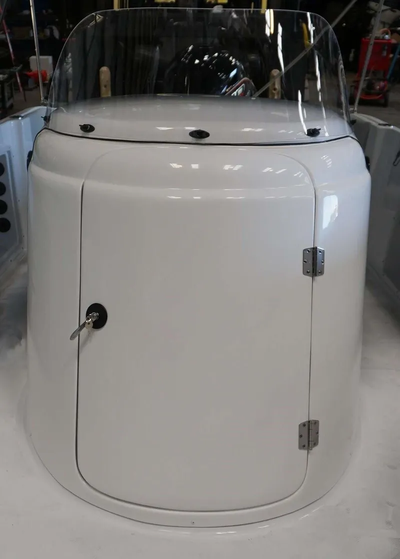 Slide: The Image of 2024 Hurricane 231 SS boat console with windshield and storage compartment. - 21