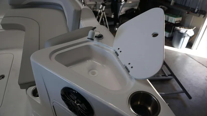 Slide: The Image of 2024 Hurricane 231 SS boat interior with open sink and seating area. - 5