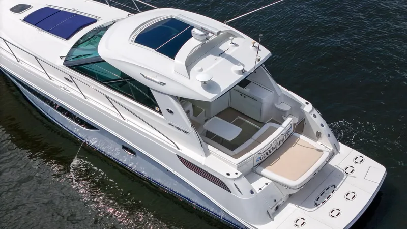 Slide: The Image of 2013 Sea Ray 450 Sundancer yacht on water, aerial view. - 12