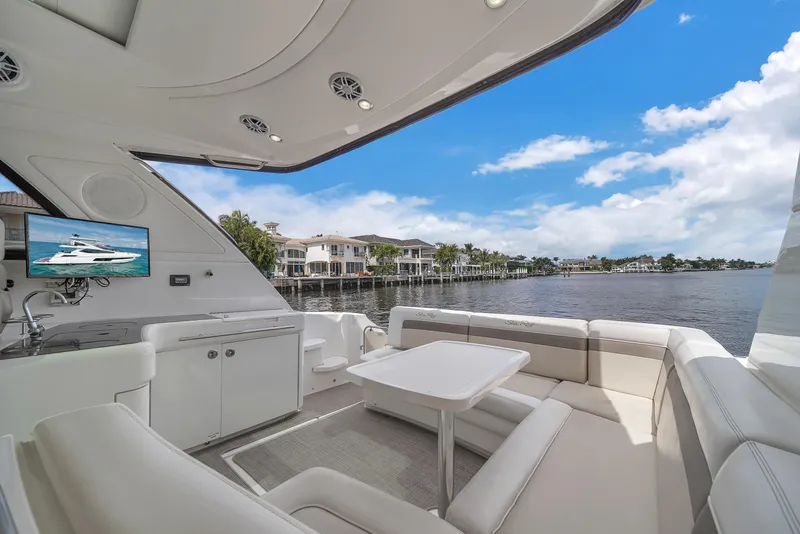 Slide: The Image of Luxurious 2013 Sea Ray 450 Sundancer yacht interior with waterfront view and modern amenities. - 20