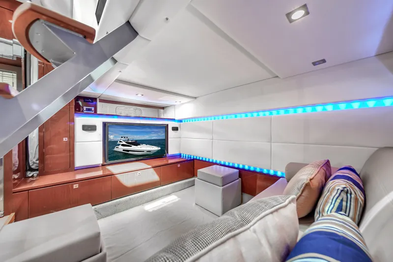 Slide: The Image of Luxurious interior of 2013 Sea Ray 450 Sundancer yacht with modern seating and ambient lighting. - 31