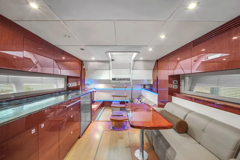 Slide: The Image of Luxurious interior of 2013 Sea Ray 450 Sundancer yacht with modern furnishings and ambient lighting. - 32