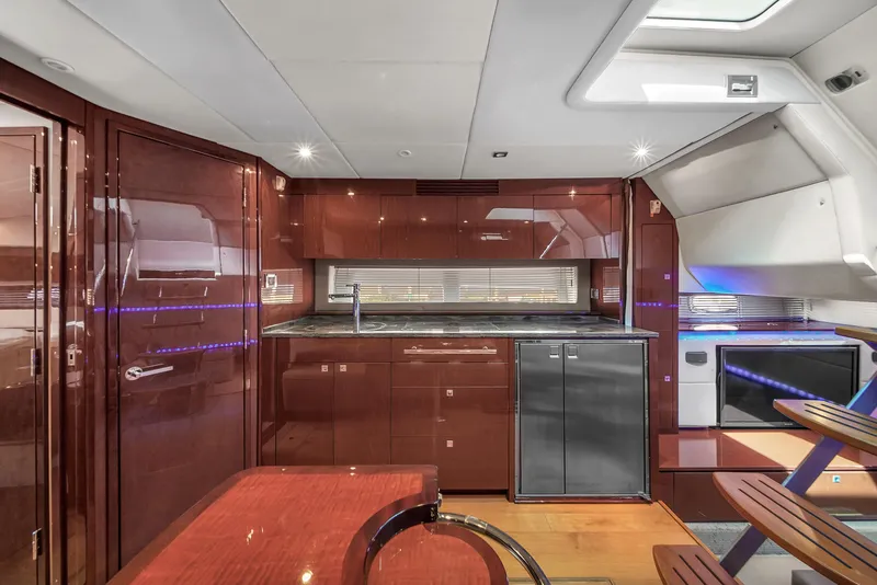 Slide: The Image of Luxurious interior of 2013 Sea Ray 450 Sundancer yacht with modern kitchen amenities. - 33