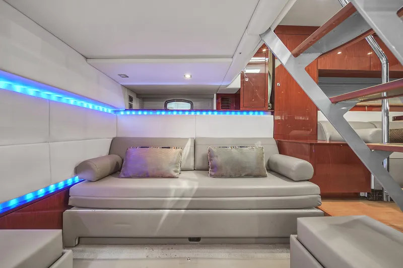 Slide: The Image of Luxurious interior of 2013 Sea Ray 450 Sundancer yacht with modern seating and ambient lighting. - 34