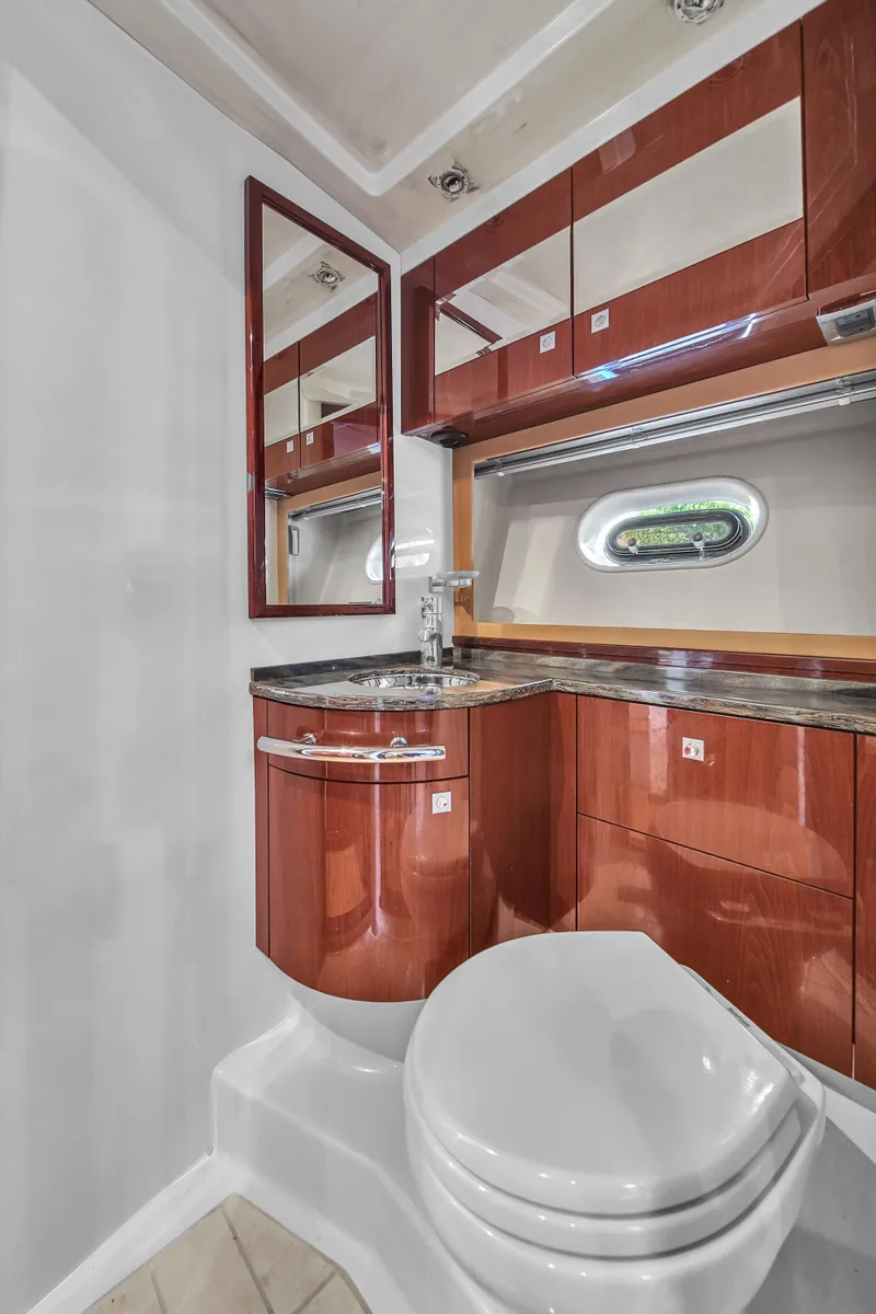 Slide: The Image of Luxurious bathroom interior of 2013 Sea Ray 450 Sundancer yacht with wood cabinetry. - 36