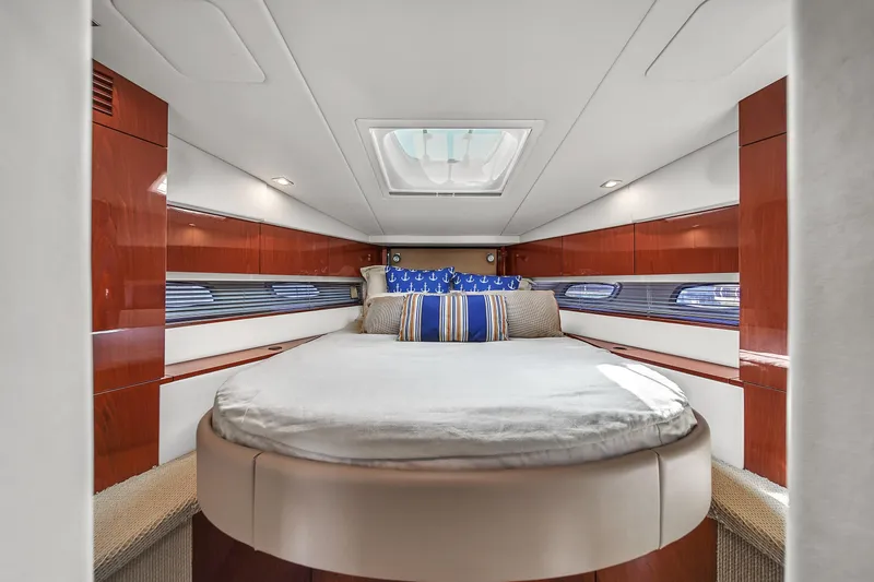 Slide: The Image of Luxurious cabin interior of 2013 Sea Ray 450 Sundancer yacht with elegant bedding. - 37