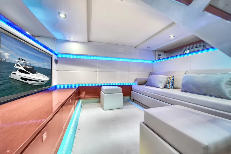 Slide: The Image of Luxurious interior of 2013 Sea Ray 450 Sundancer yacht with modern seating and ambient lighting. - 39