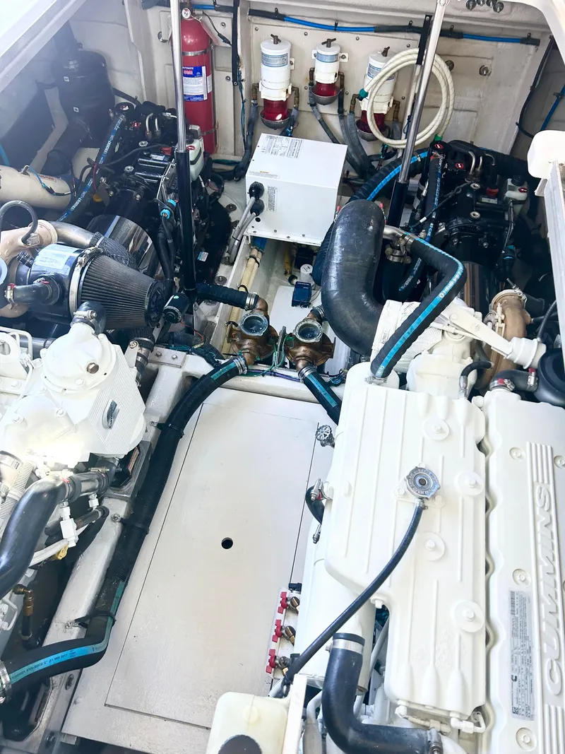 Slide: The Image of Engine room of a 2013 Sea Ray 450 Sundancer with visible components and equipment. - 48