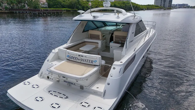 Slide: The Image of 2013 Sea Ray 450 Sundancer yacht cruising on a calm waterway. - 9