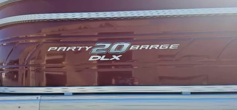 Slide: The Image of 2024 Sun Tracker Party Barge 20 DLX logo on maroon background. - 2