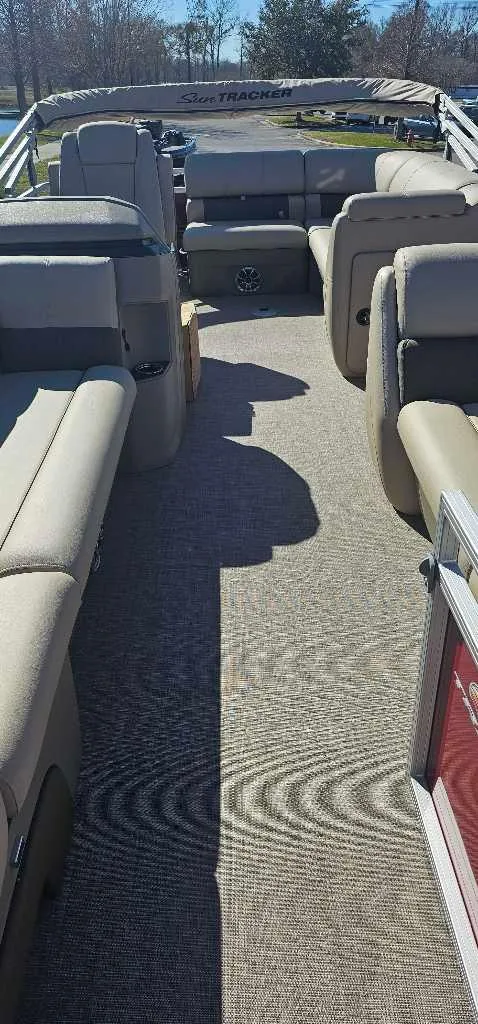 Slide: The Image of 2024 Sun Tracker Party Barge 20 DLX interior with spacious seating and modern design. - 4