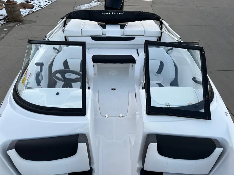 Slide: The Image of 2024 Tahoe 185 S boat interior with open windshield and seating. - 7