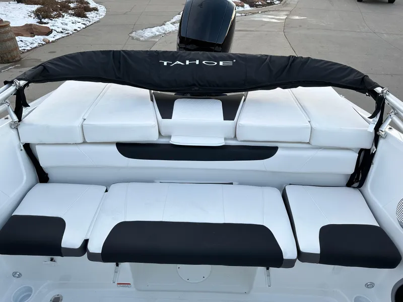Slide: The Image of 2024 Tahoe 185 S boat with white and black seating, rear view. - 8