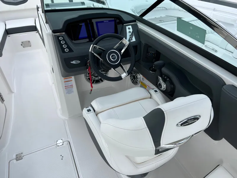 Slide: The Image of 2023 Chaparral 250 OSX boat cockpit with modern steering and control panel. - 10
