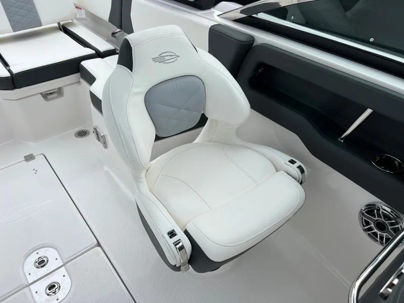 Slide: The Image of 2023 Chaparral 250 OSX boat interior with white and gray captain's chair. - 16