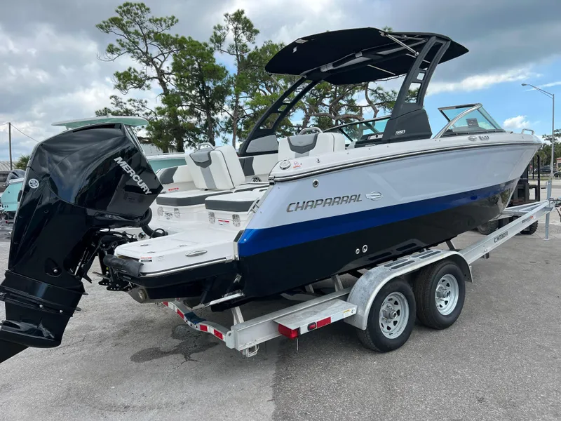 Slide: The Image of 2023 Chaparral 250 OSX boat on trailer with Mercury outboard motor. - 2