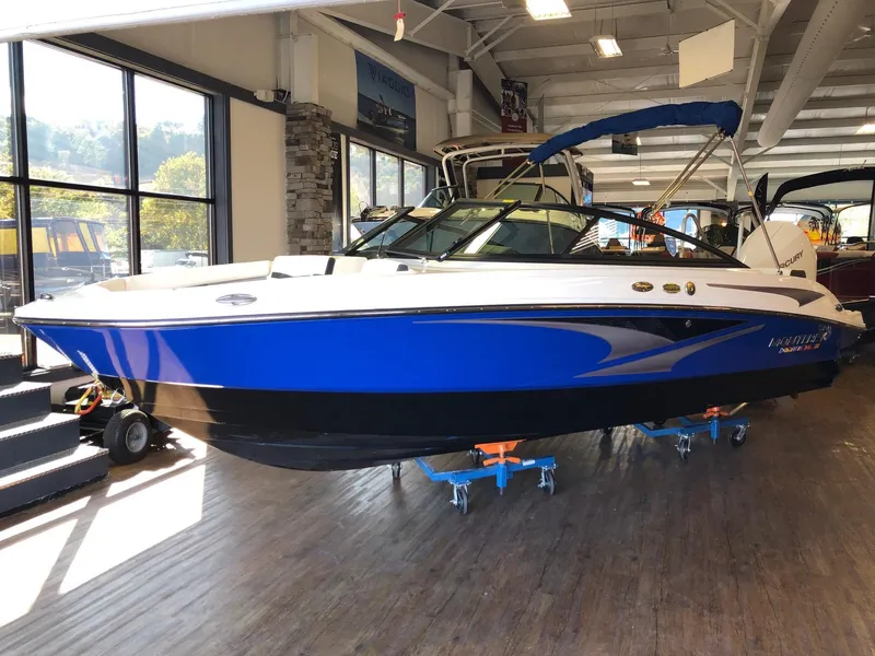 The Image of 2024 Monterey M-205 boat on display in a showroom. - 1