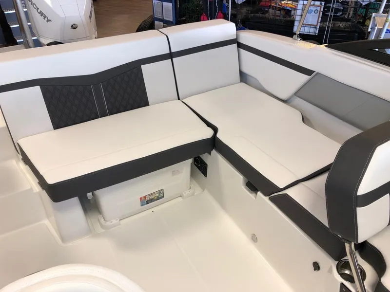 Slide: The Image of 2024 Monterey M-205 boat interior with white and gray seating. - 14