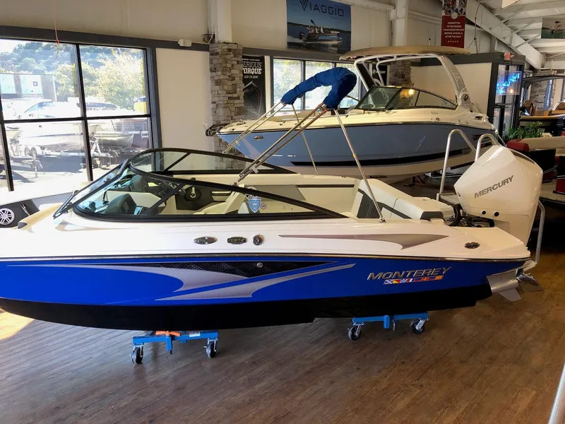 Slide: The Image of 2024 Monterey M-205 boat on display in a showroom. - 3