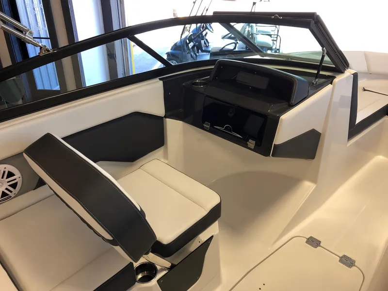 Slide: The Image of 2024 Monterey M-205 boat interior with helm and seating. - 9